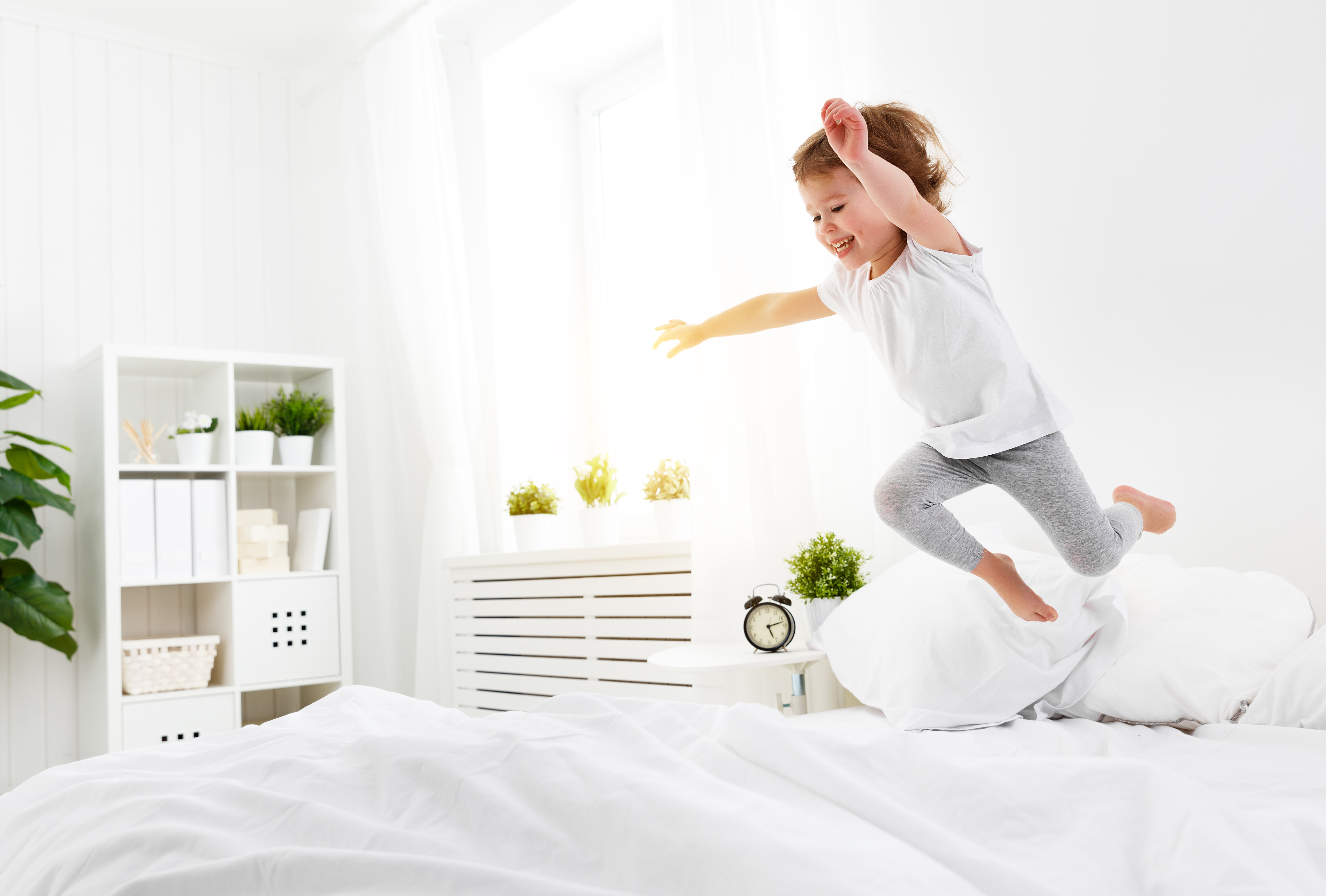 Toddler Smiling & Jumping on the Bed